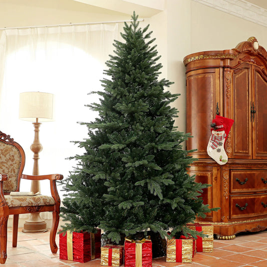 Decorated Christmas tree with presents and a stocking in a living room setting.