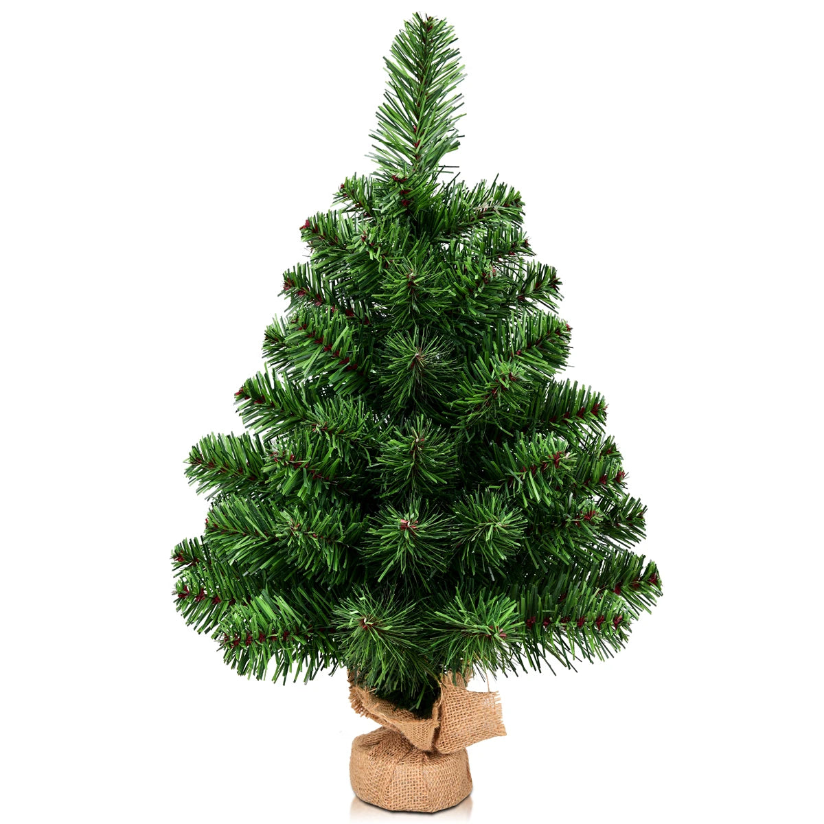 Small artificial Christmas tree with a burlap base on a white background