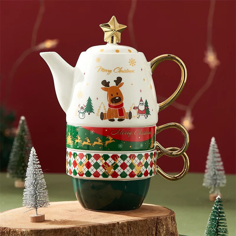 Decorative Christmas teapot and mug set with festive design on a wooden stand.