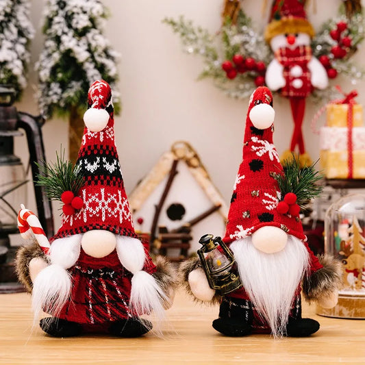 Two Christmas-themed gnomes with red hats and white beards on a wooden surface.