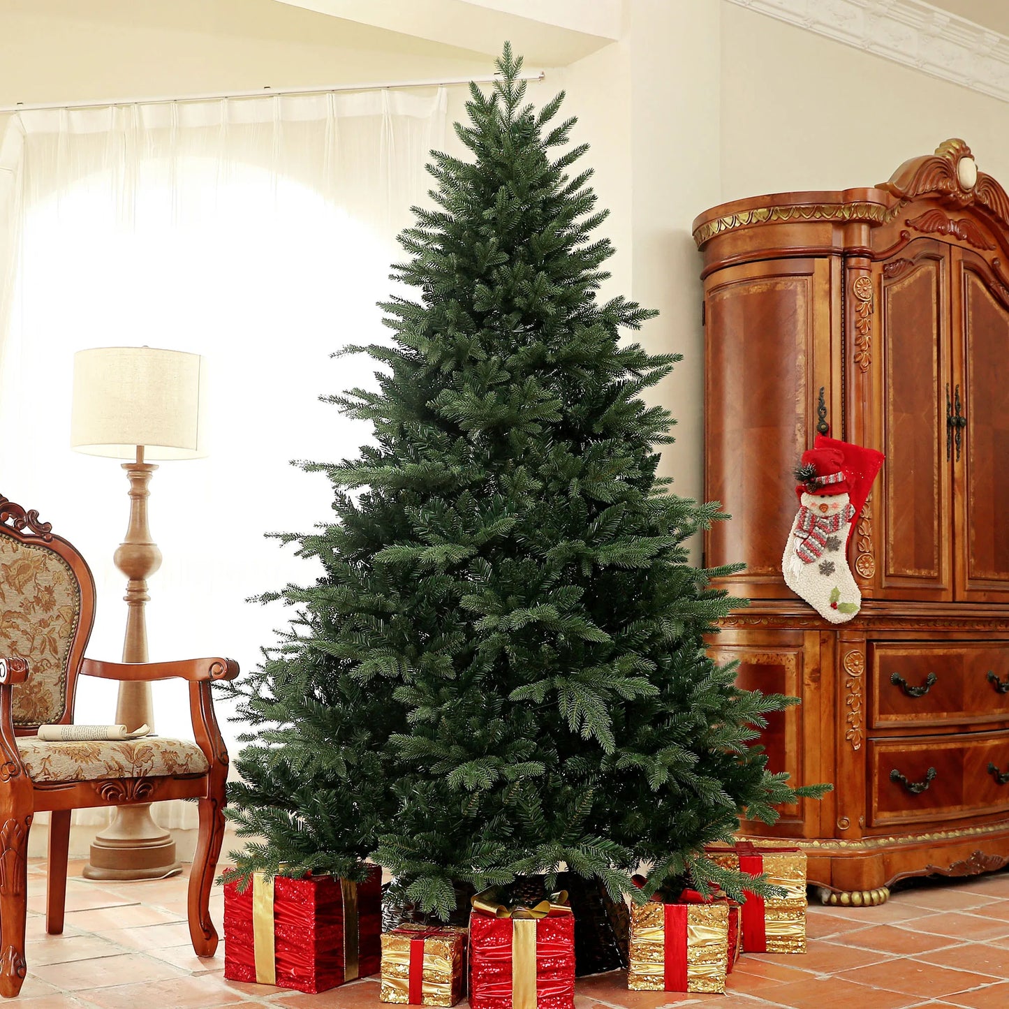 Decorated Christmas tree with presents and a stocking in a living room setting.