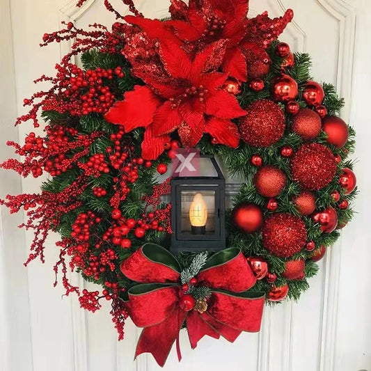 Decorative Christmas wreath with red flowers, berries, and ornaments on a door.