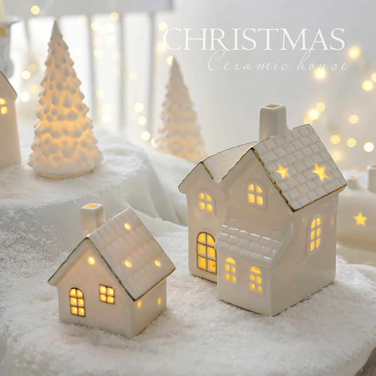 Decorative ceramic houses with glowing lights on a snowy background, labeled 'Christmas'.