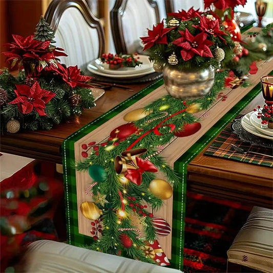 Decorative Christmas table runner with poinsettias and ornaments on a set dining table.