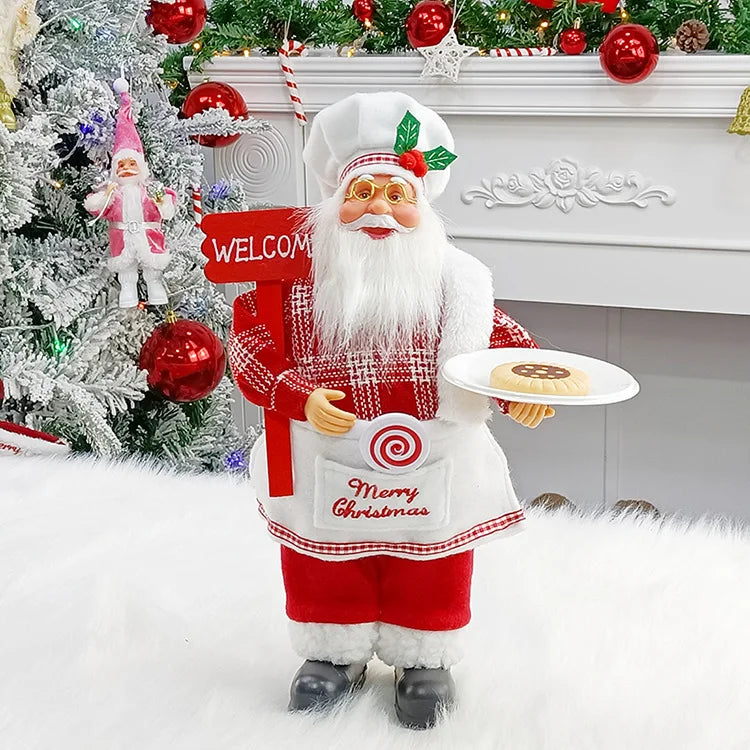 Decorative Santa Claus figure holding a plate with cookies, standing in front of a Christmas tree and fireplace.