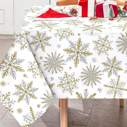 Tablecloth with snowflake pattern on a table, with Christmas decorations in the background.